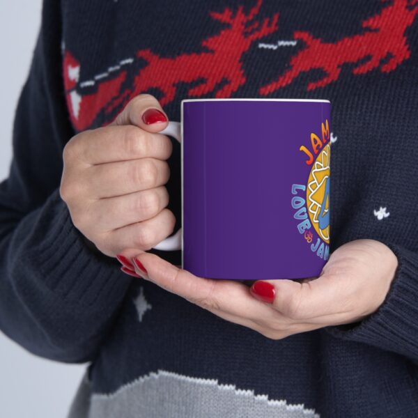 A person holding a purple coffee mug in their hands.