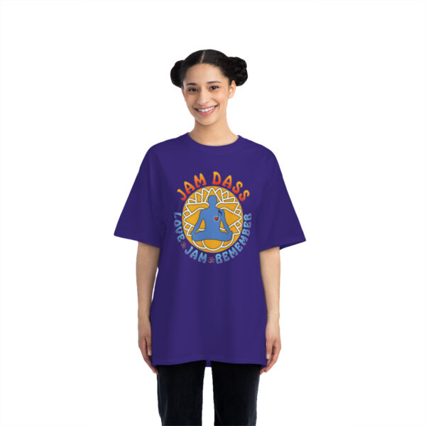A woman wearing a purple t-shirt with a design on it.